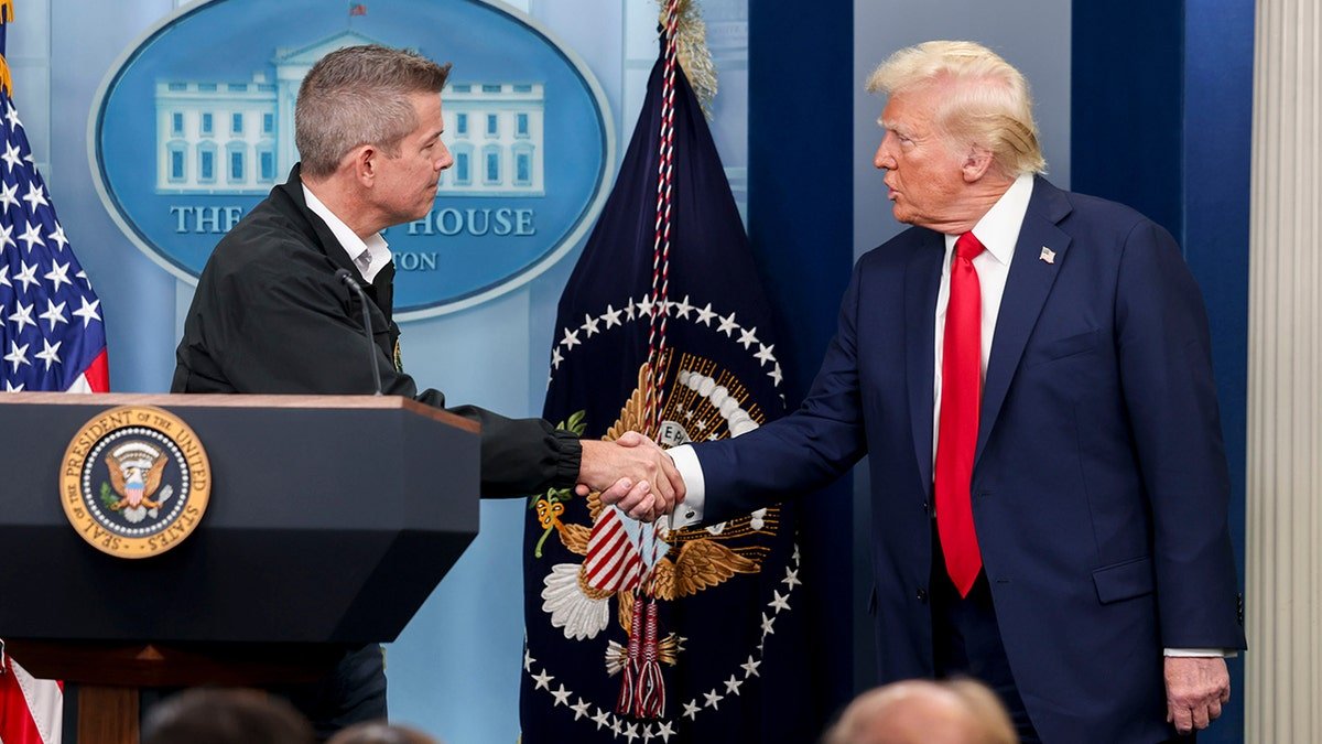 Duffy and President Donald Trump shakes back