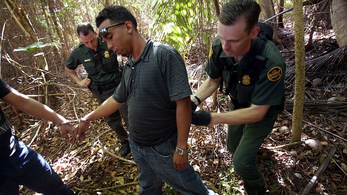 The immigrant is being arrested