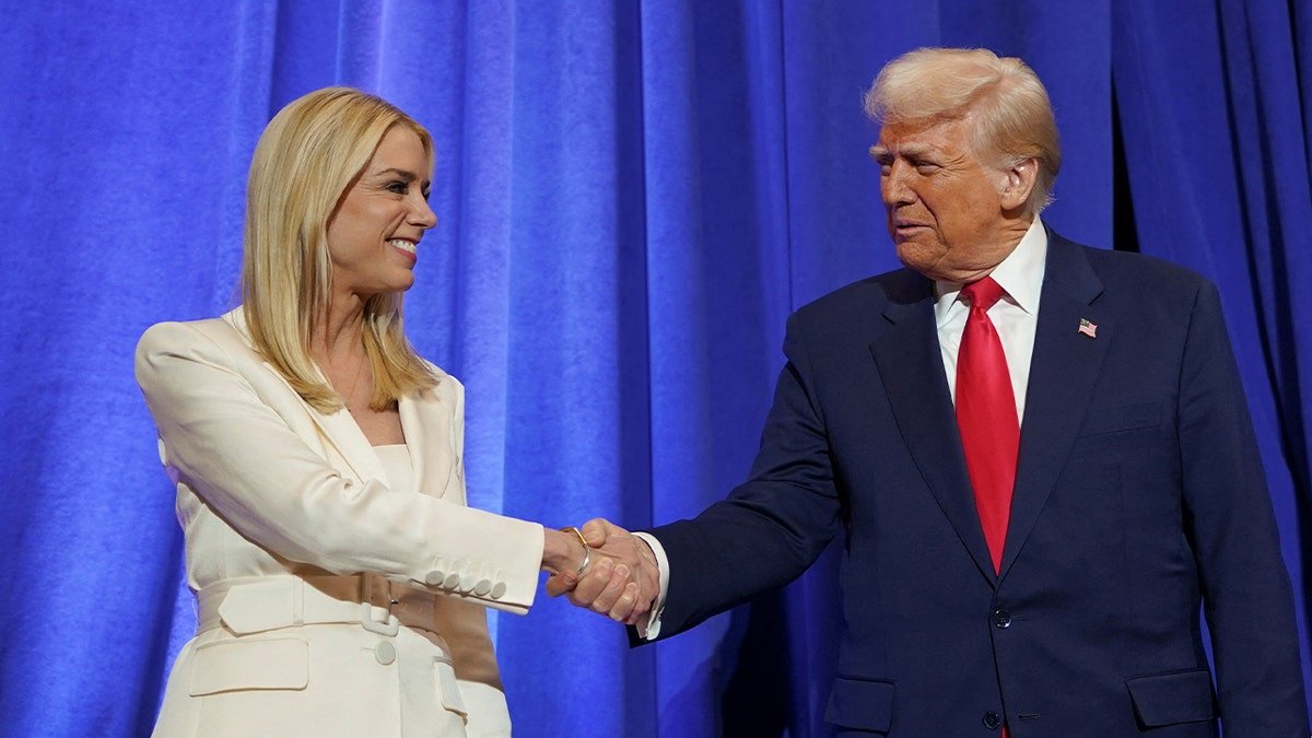 Public Prosecutor Bam Bondi is walking with President Donald Trump