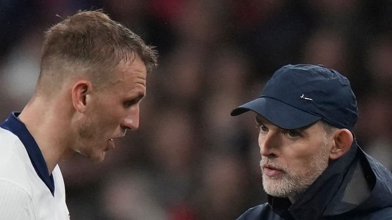 England coach Thomas Tuchille talks to Dan Bern during a qualifying football match for the World Cup between England and Albania at Wembley Stadium in London, on Friday, March 21, 2025. (AP Photo/ALASTAir Grant)