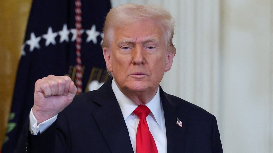 President Donald Trump raises the grip
