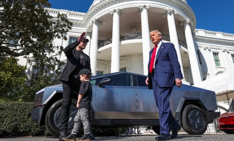 67d3e8eaa33c6 donald trump and elon musk with tesla cars in the background at the white house reuter.jpeg