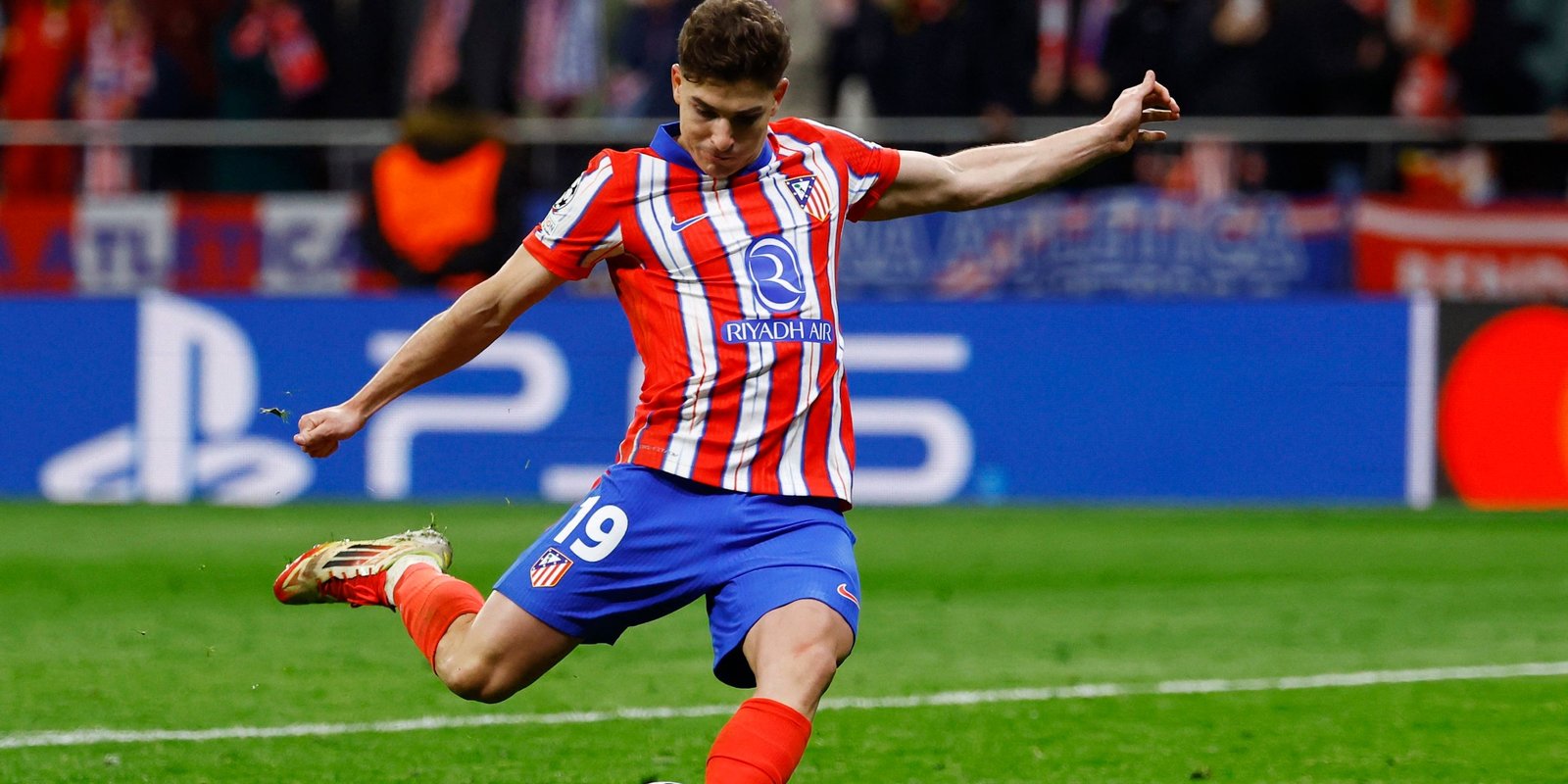 Julian Alvarez from Atletico Madrid scores a penalty during a penalty kick that was later neglected after VAR review