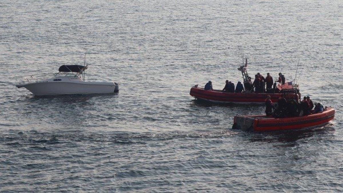 Illegal immigrants on boats being held by the Coast Guard