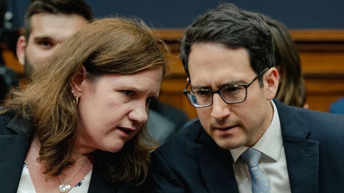 Commissioners of the Federal Trade Committee, Rebecca Kelly Slier, chats with Alvaro Bedoya (PBUH), in front of the Chairman of the Federal Trade Committee, Lina Khan, during the hearing of the Judicial Committee in the House of Representatives at the Ripporen House office building in the Capitol Hill in Washington, on July 13, 2023.