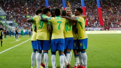 brazil s raphinha celebrates scoring their first goal with teammates.JPG