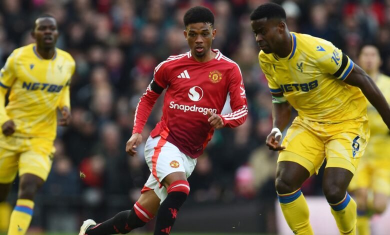 crystal palace s marc guehi in action with manchester united s amad diallo.JPG