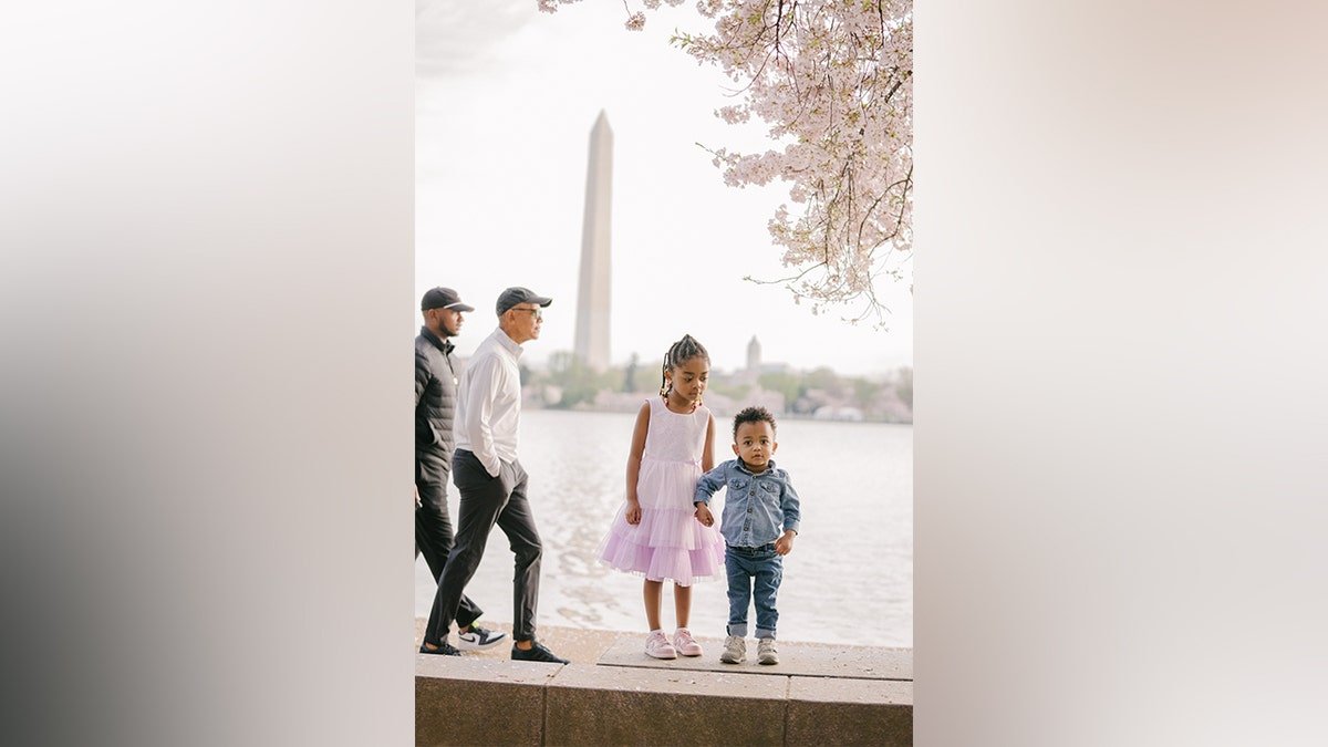 Former President Barack Obama is walking through the family image