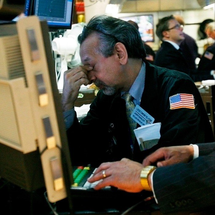 Merchants work on the New York Stock Exchange floor