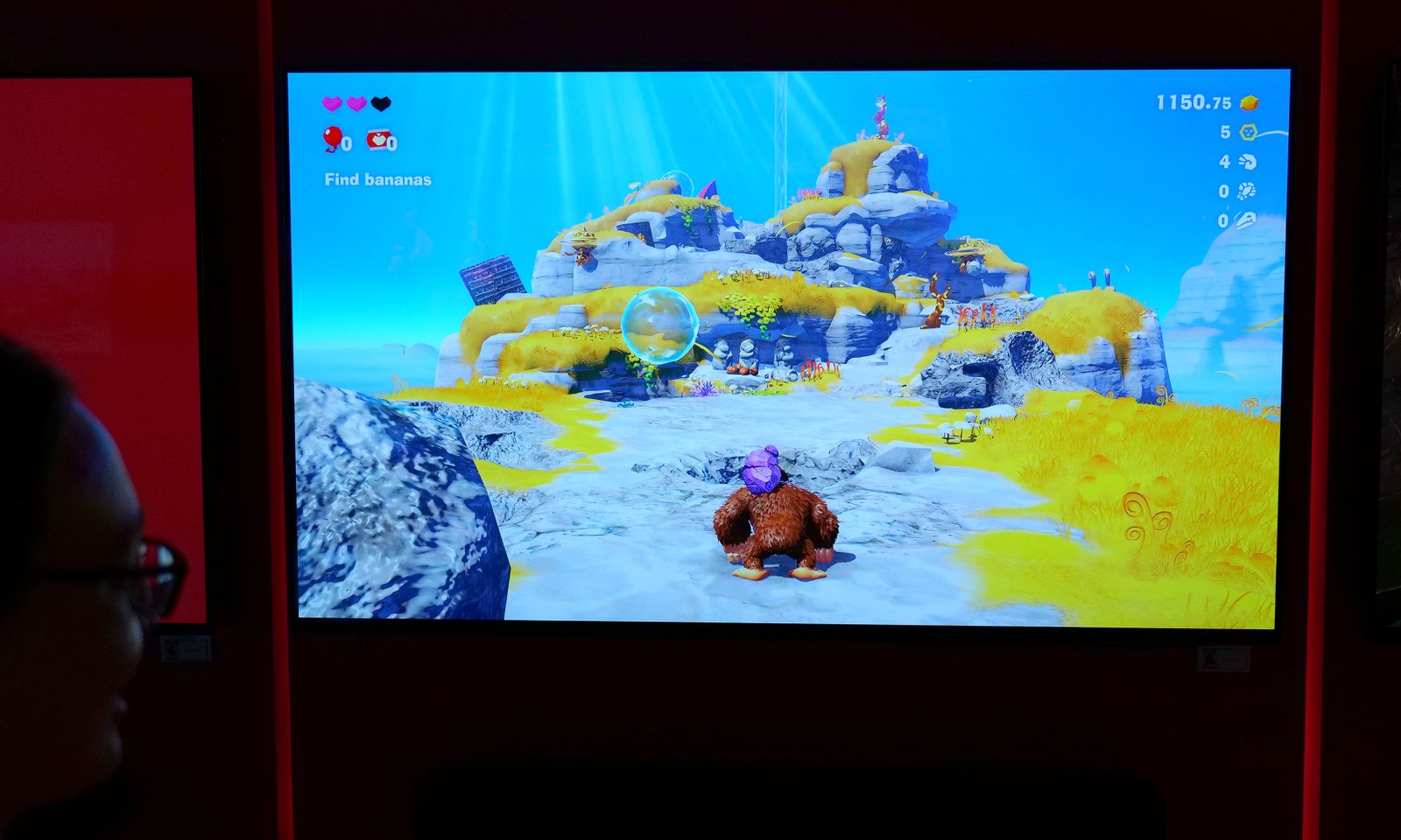 The Purple Rock on DK's shoulder is his new companion in Donkey Kong Banza.