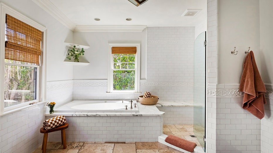 The inner bathroom is characterized by a bath and bathing.