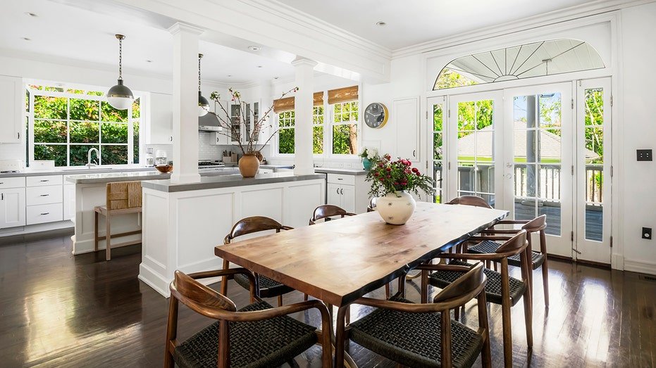 The kitchen also includes an informal dining area.