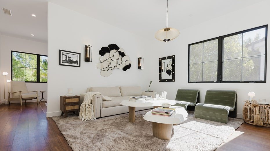 The basic secondary wing includes a living space with a white sofa and green chairs.