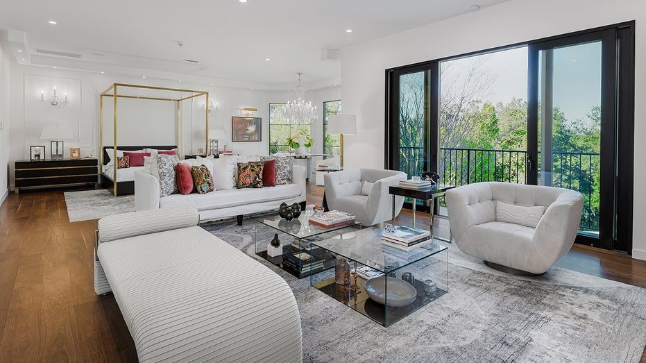 The basic bedroom features a private balcony and a large seating area.