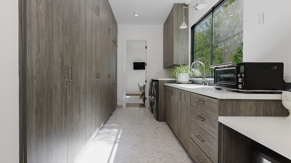 The lower level also features a bitrler kitchen.