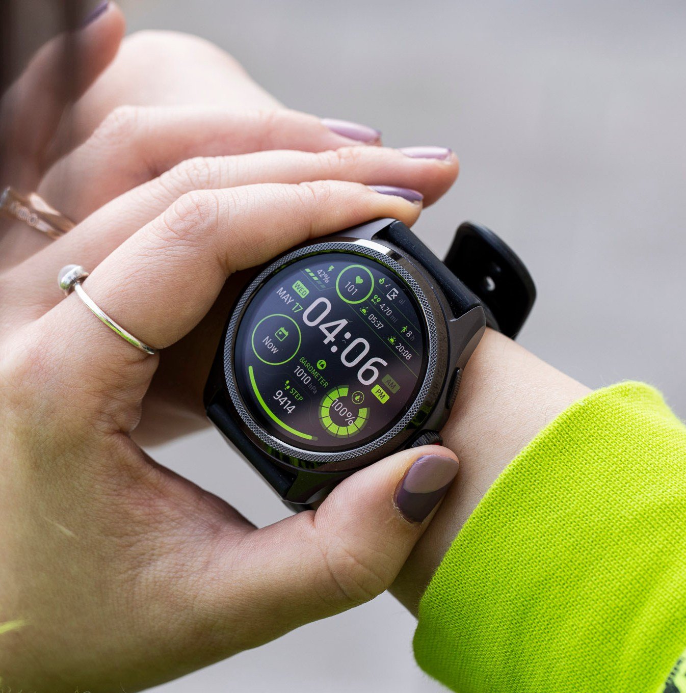 Close-up of person pressing the TicWatch Pro 5’s digital crown