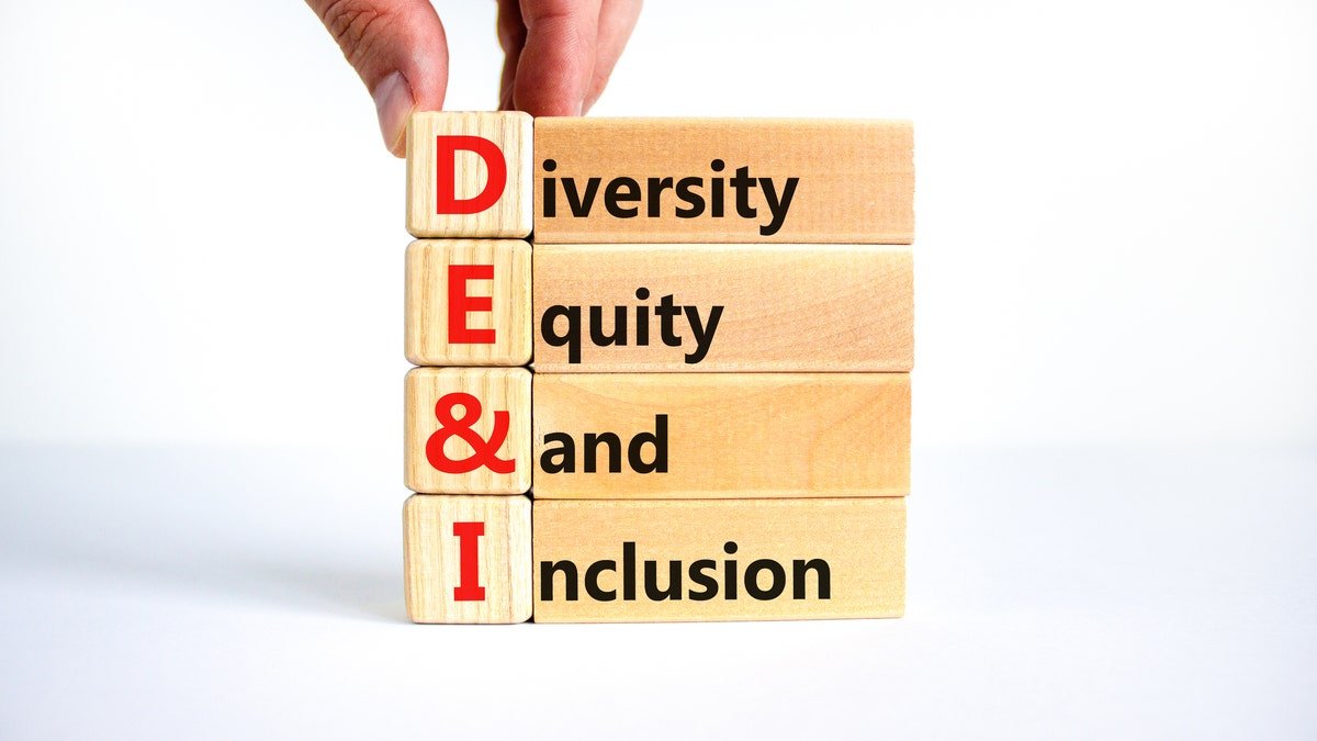 Dei, diversity, fairness and inclusion on wooden cubes