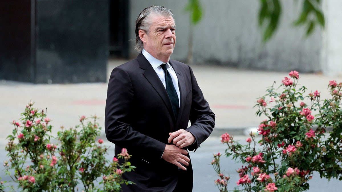 Kevin Morris is walking outside the federal court