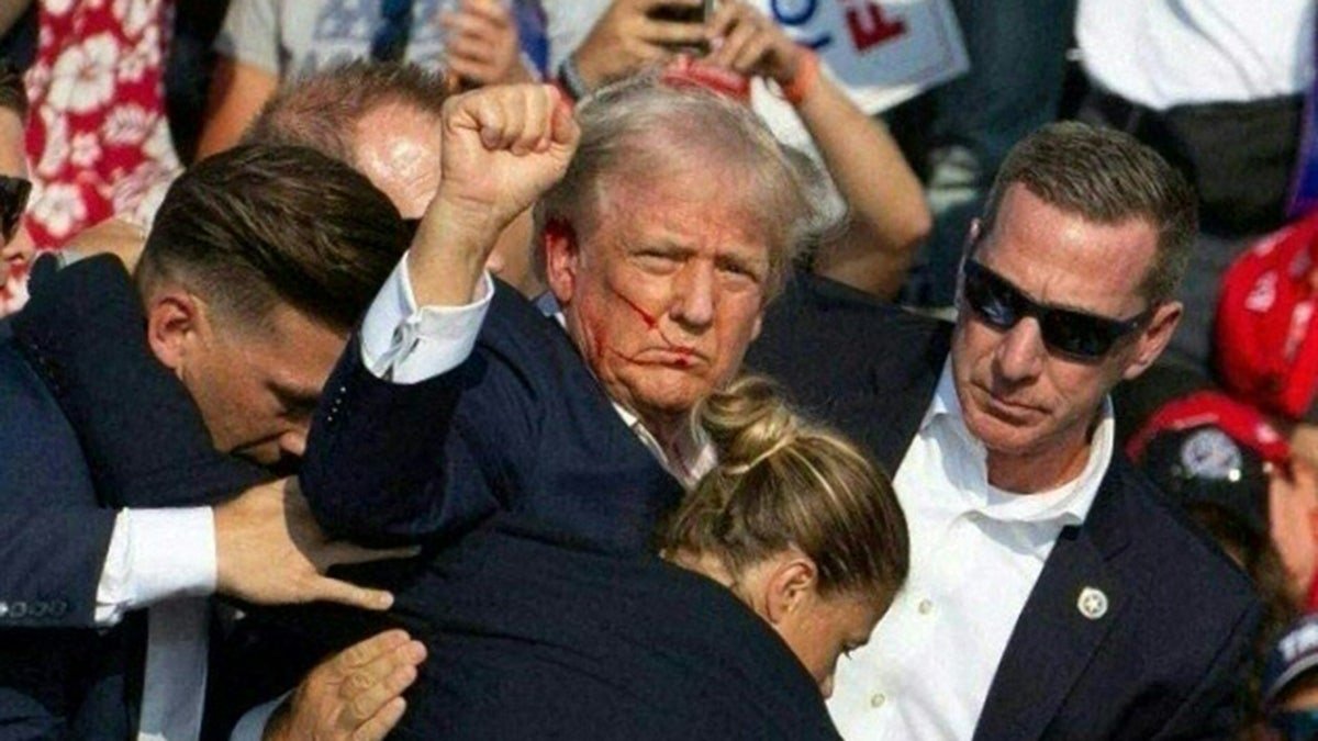 Trump holds a fist