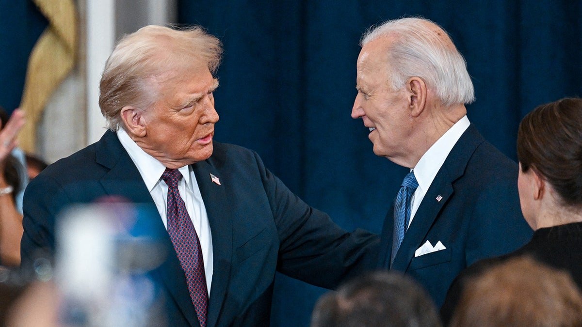 President Donald Trump speaks with President Joe Biden in his inauguration
