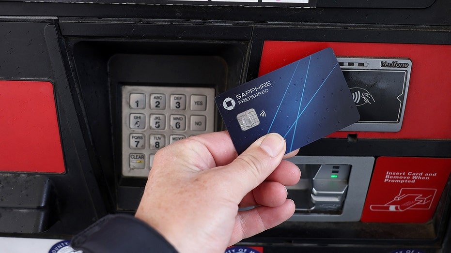 The credit card is used to pay the price of gasoline