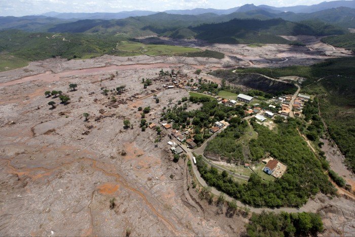 Air view of the mud -covered area, with some remaining buildings and green spaces