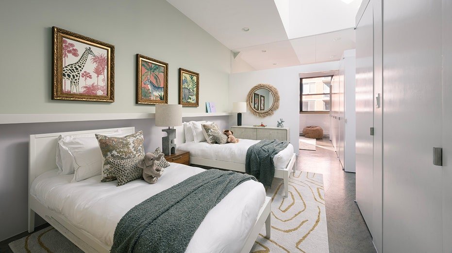 A third bedroom has two whole beds and animal paintings on the walls.