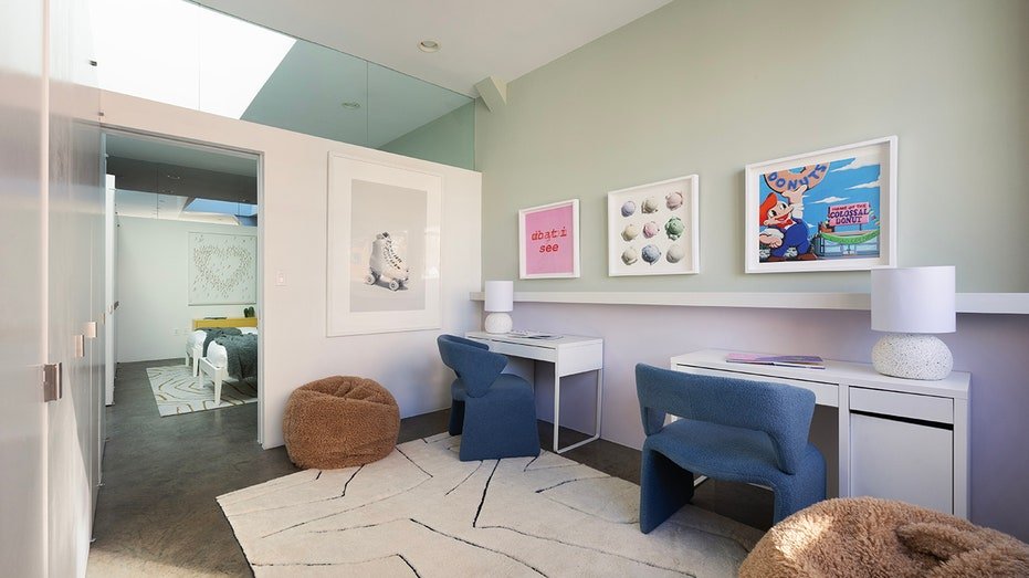 One of the bedrooms is currently supplied as a study area with leani offices and chairs.