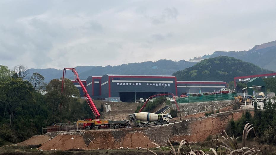 Workers and vehicles are seen in Li -Yichun fuse, Jiangshi Province, China on March 30, 2023.