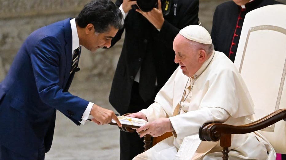 Pope Francis speaks with the CEO of Deloitte Punit Renjen