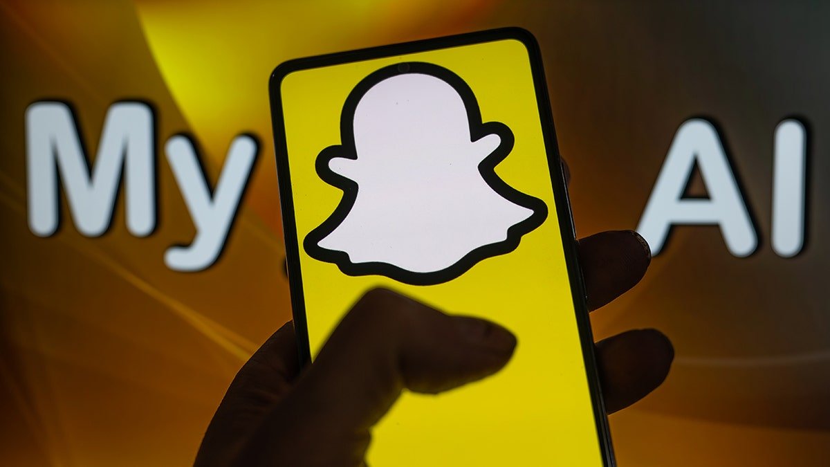 Snapchat AI logo on the cell phone