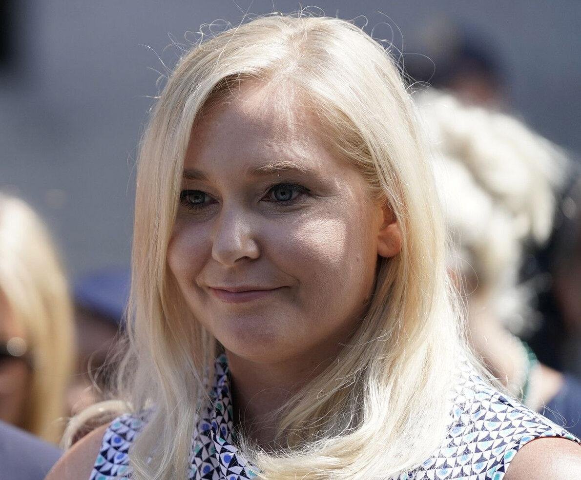 One of the alleged victims of Jeffrey Epstein, Virginia Roberts Givry, speaks to the right at a press conference after a hearing where the alleged victims of Epsin made statements in the Manhattan Federal Court on August 27, 2019, in New York.