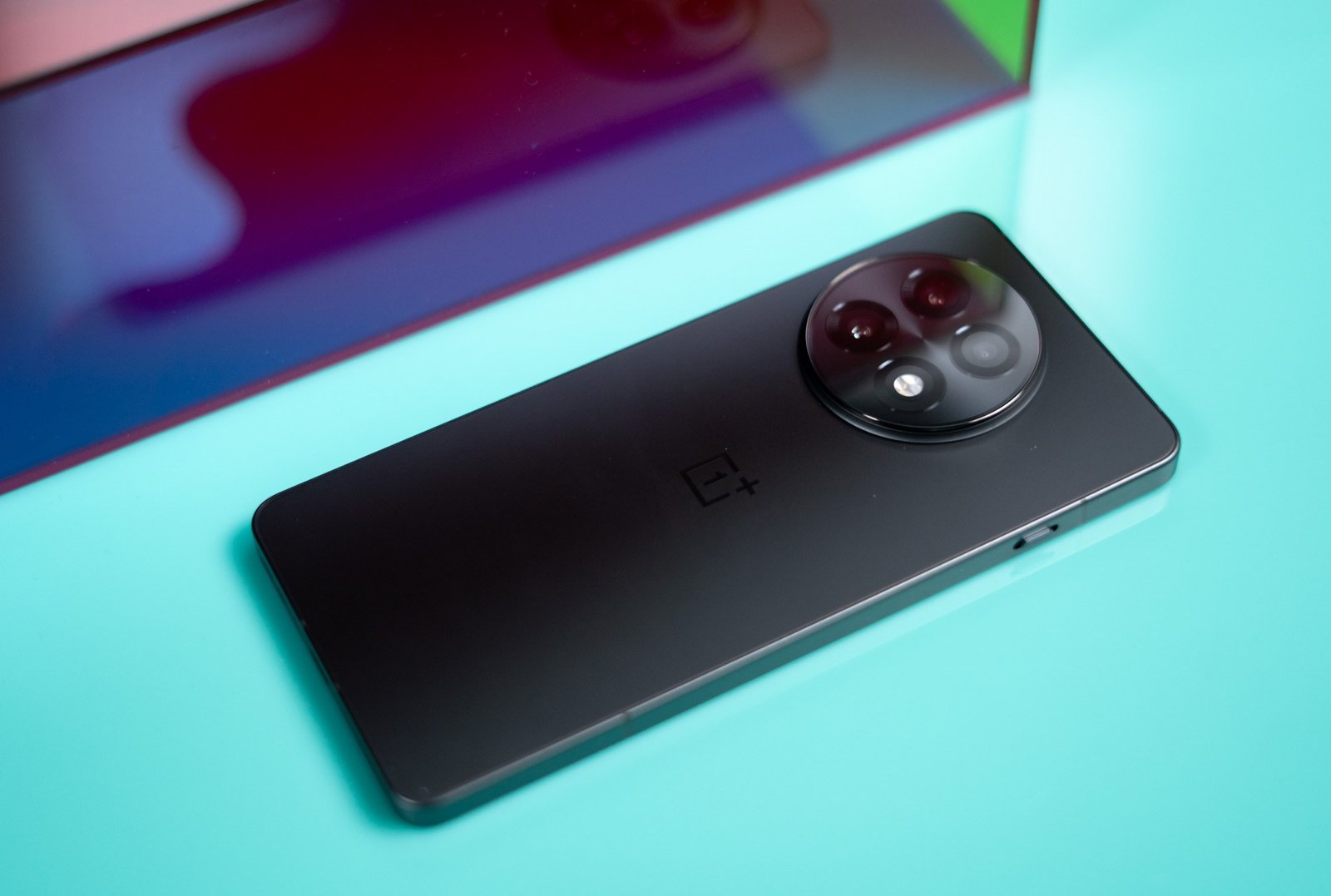 OnePlus 13R against a blue background