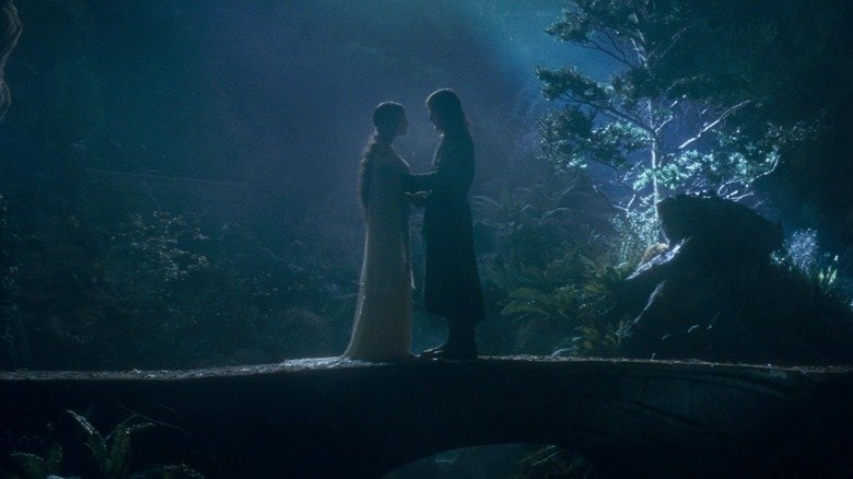 Arwin and Arajorn stand together in a garden in River