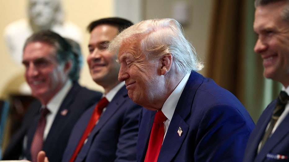 President Donald Trump interacts during the cabinet meeting
