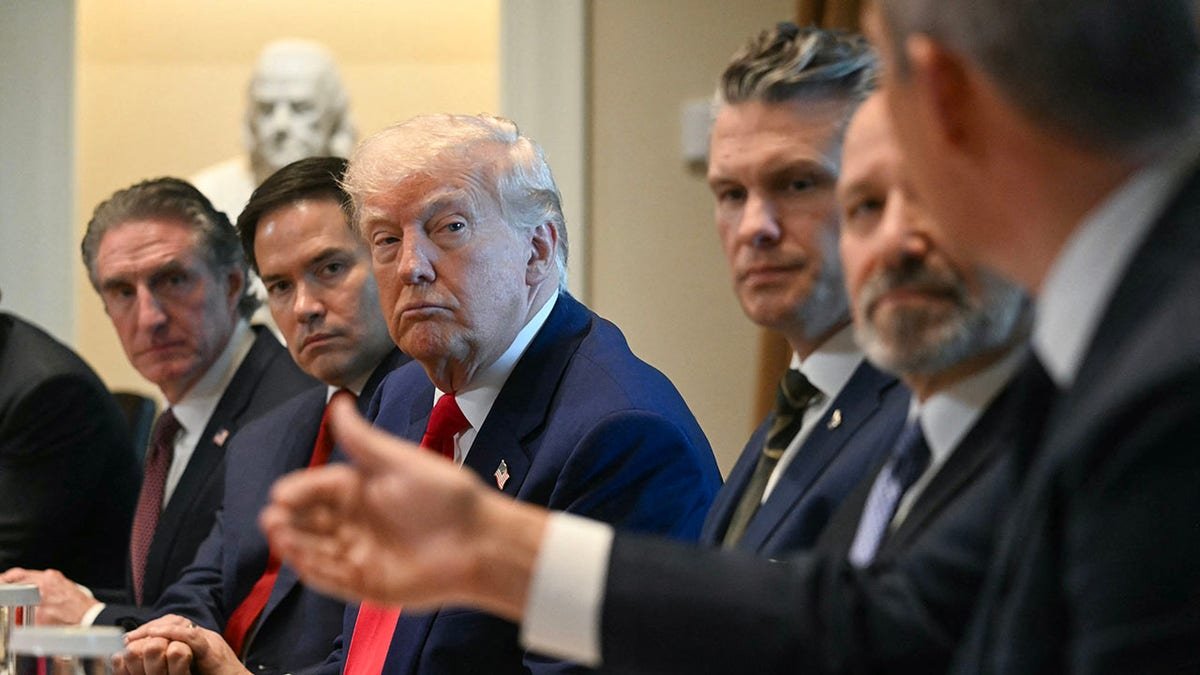 Trump listens during the cabinet meeting