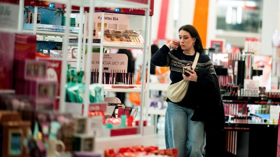 A woman looks at cosmetics in a local store in New York City on December 10, 2023.
