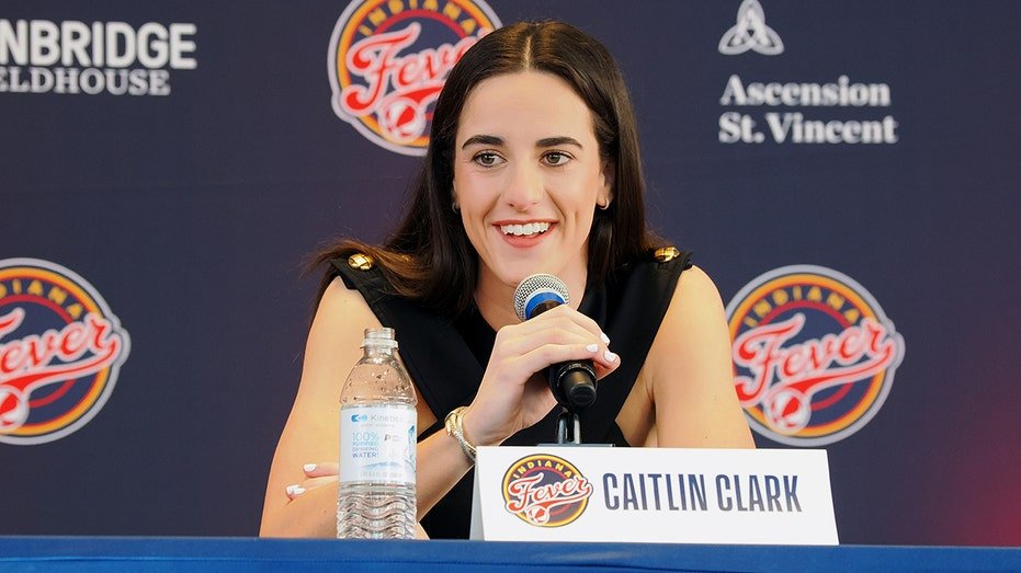 Caitlin Clark talks to the microphone
