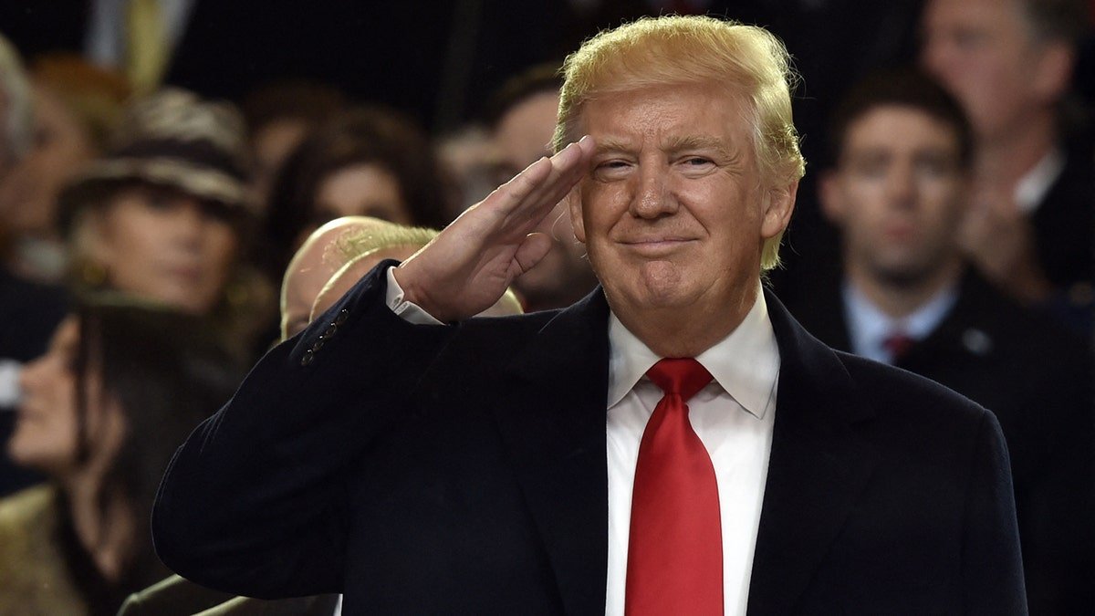 Topshot - US President Donald Trump will revive during the presidential opening presentation on January 20, 2017 in Washington, DC.