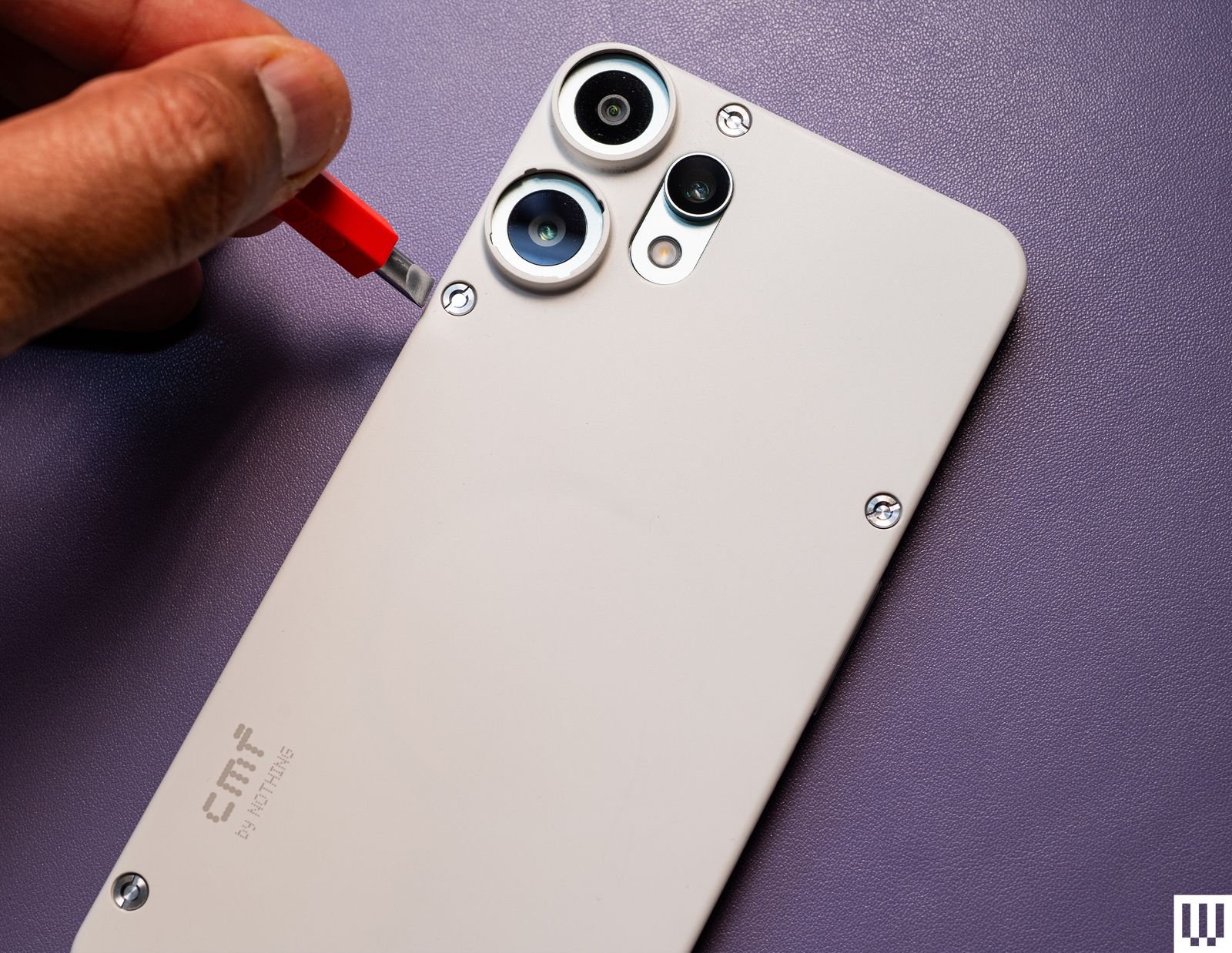 The image may have a child's mobile phone and a person