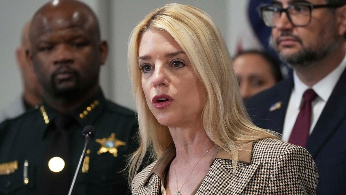 Pam Bondi speaks in the microphone