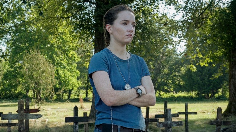 Abe stands beside the graves of dead bridges in the last season of the United States 2