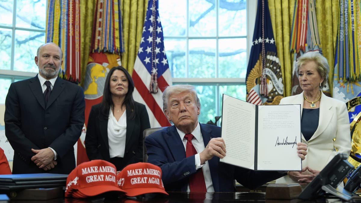 President Donald Trump with Linda McMahon at the Oval Office