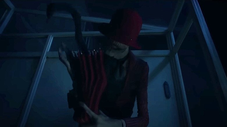 The twisted man goes in the hallway in the evocation 2