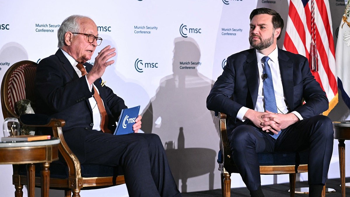 Vans and Munich conference official at the capital's event on the stage
