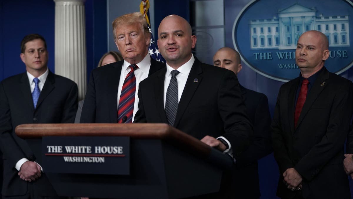 President Trump holds a press conference with the boundaries of ice agents