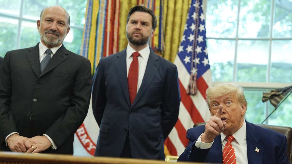 President Donald Trump, right, gestures and was joined by Vice President C.