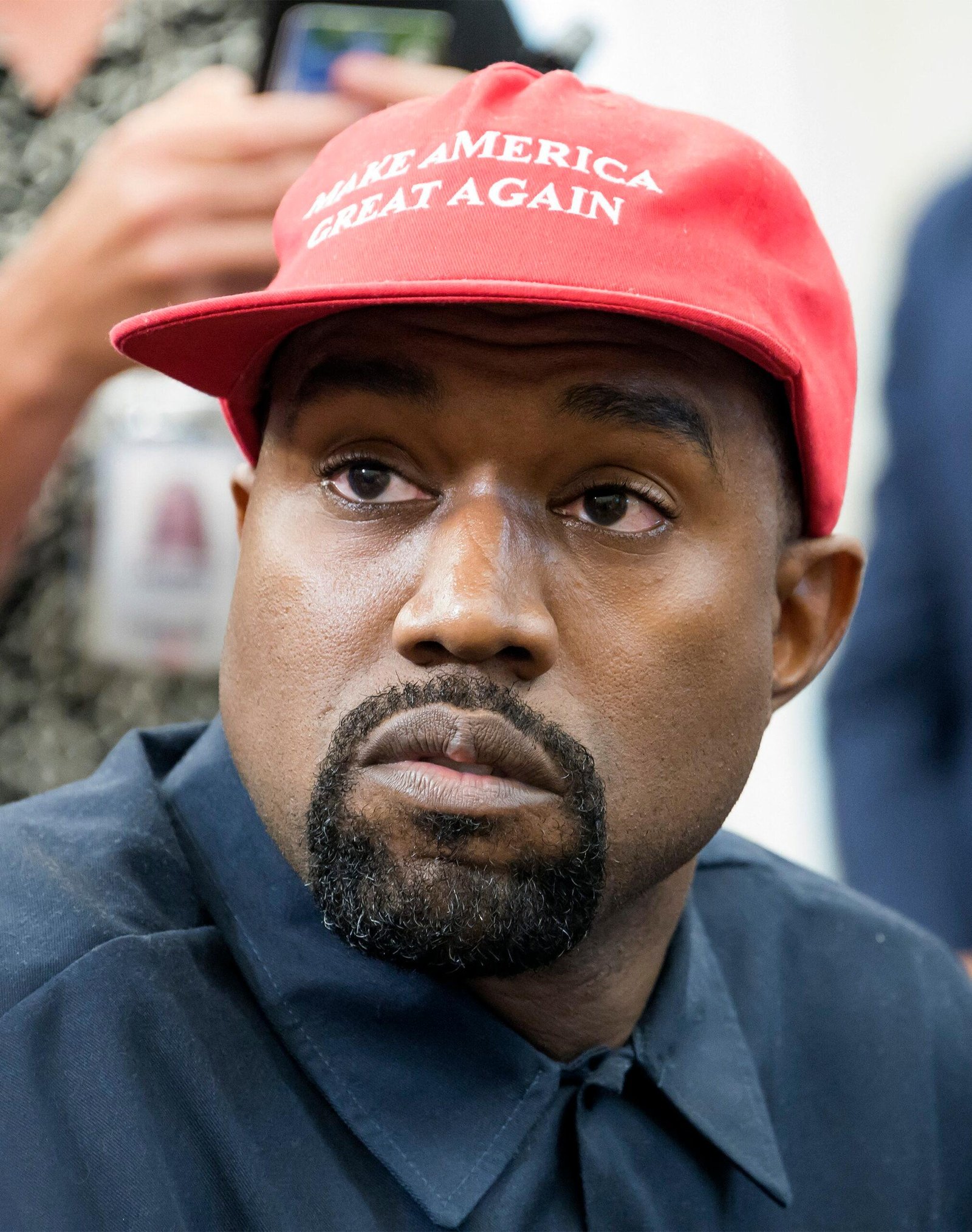 Kanye West wears the Maga hat