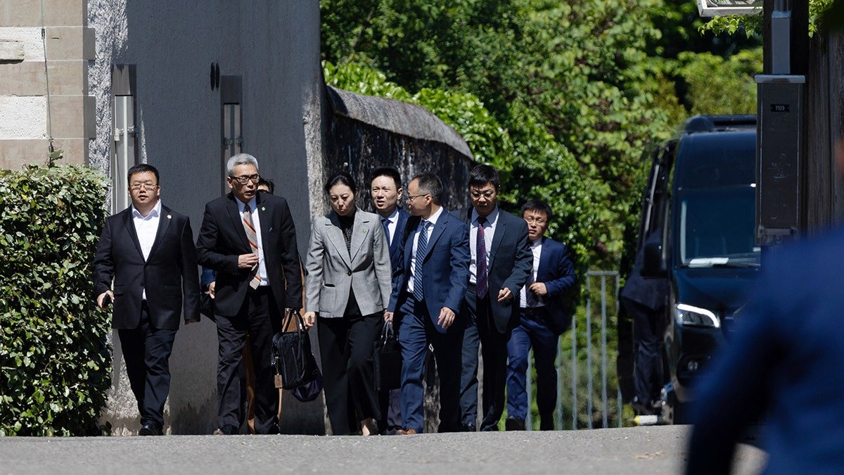 Members of the Chinese delegation leave the residence, as commercial talks occur between Chinese and American delegations in Geneva