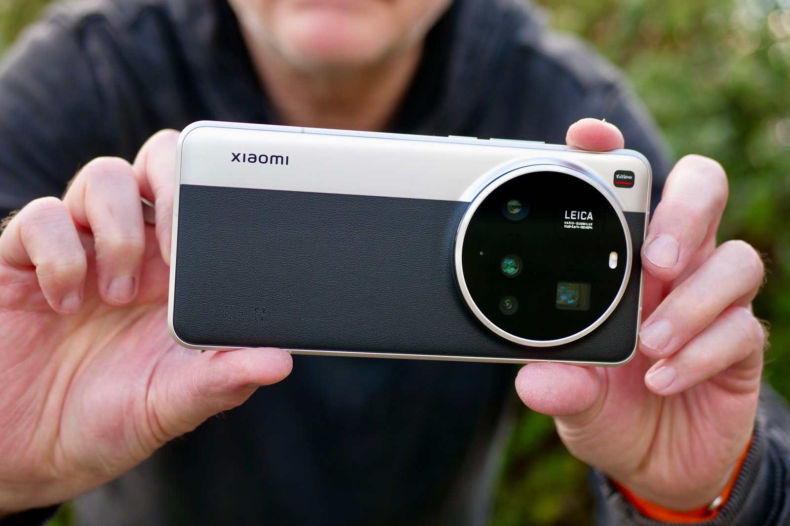 A person takes a picture with Xiaomi 15 Ultra.